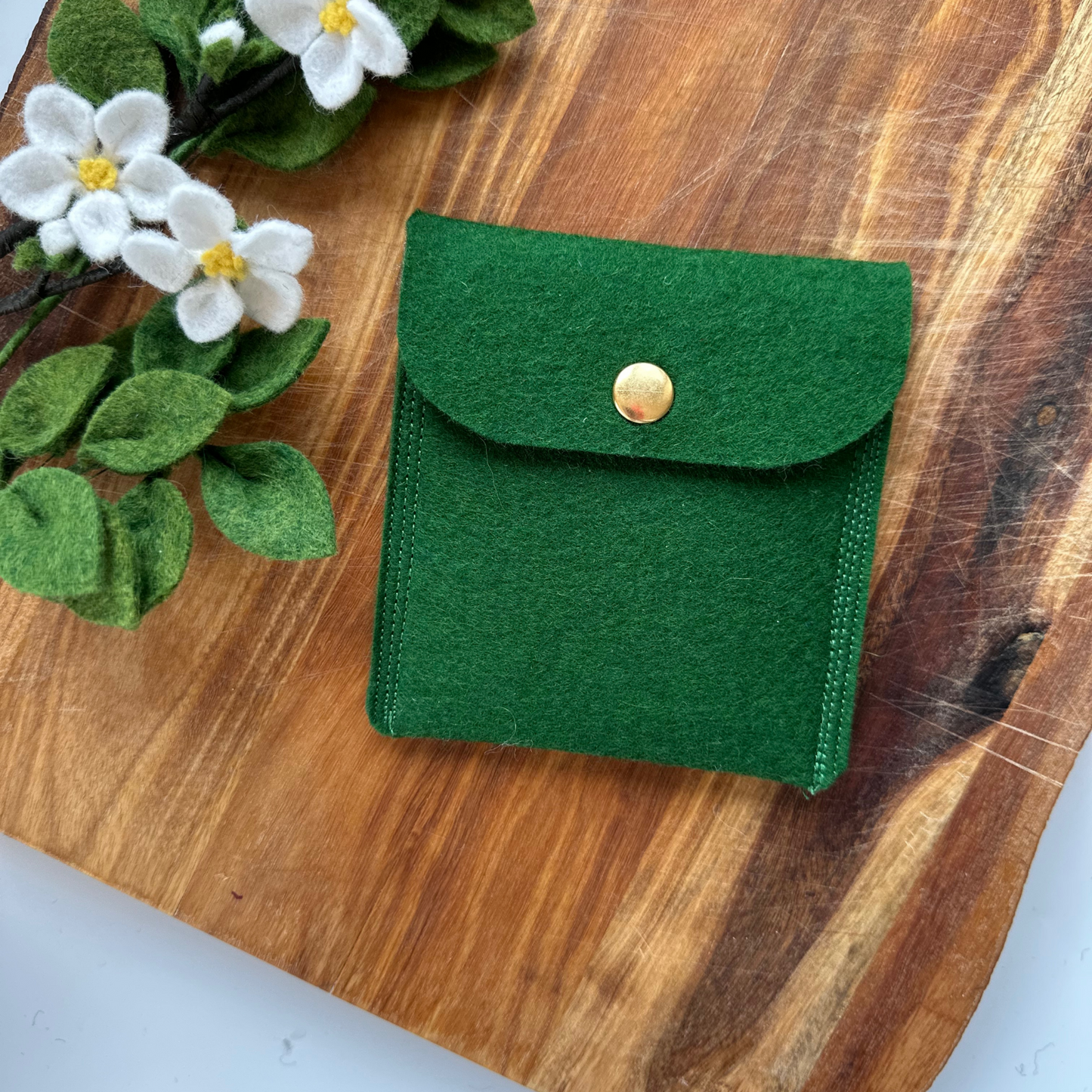 Green merino felt pouch with gold press stud