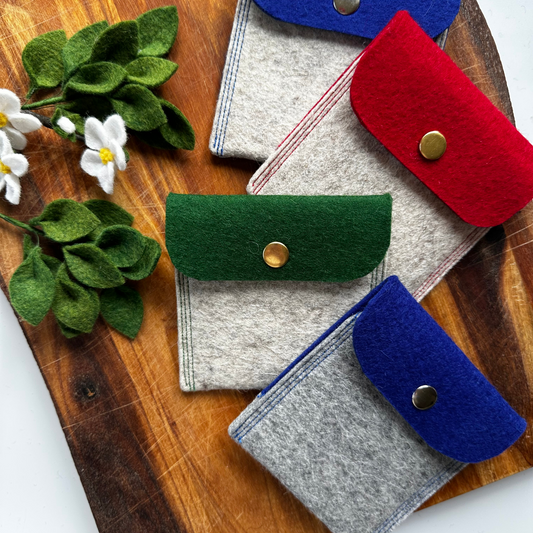 Group shot of two tone felt pouches